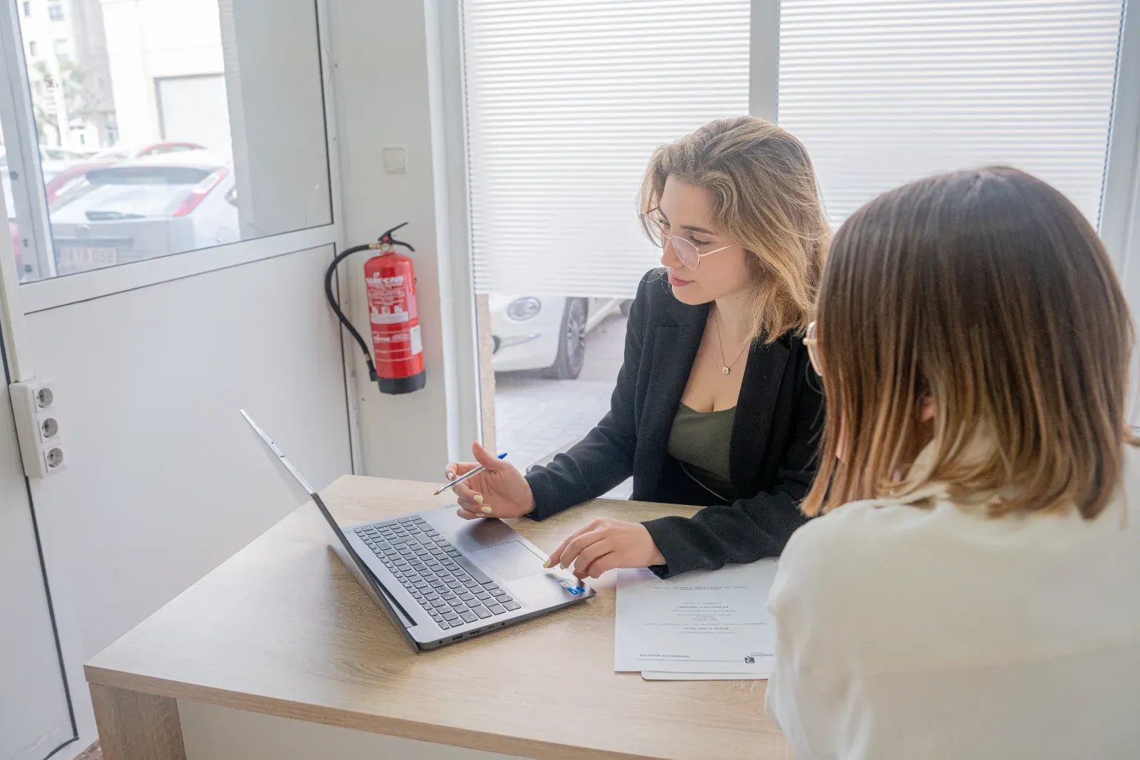 Miriam Acerete meeting a client at her office