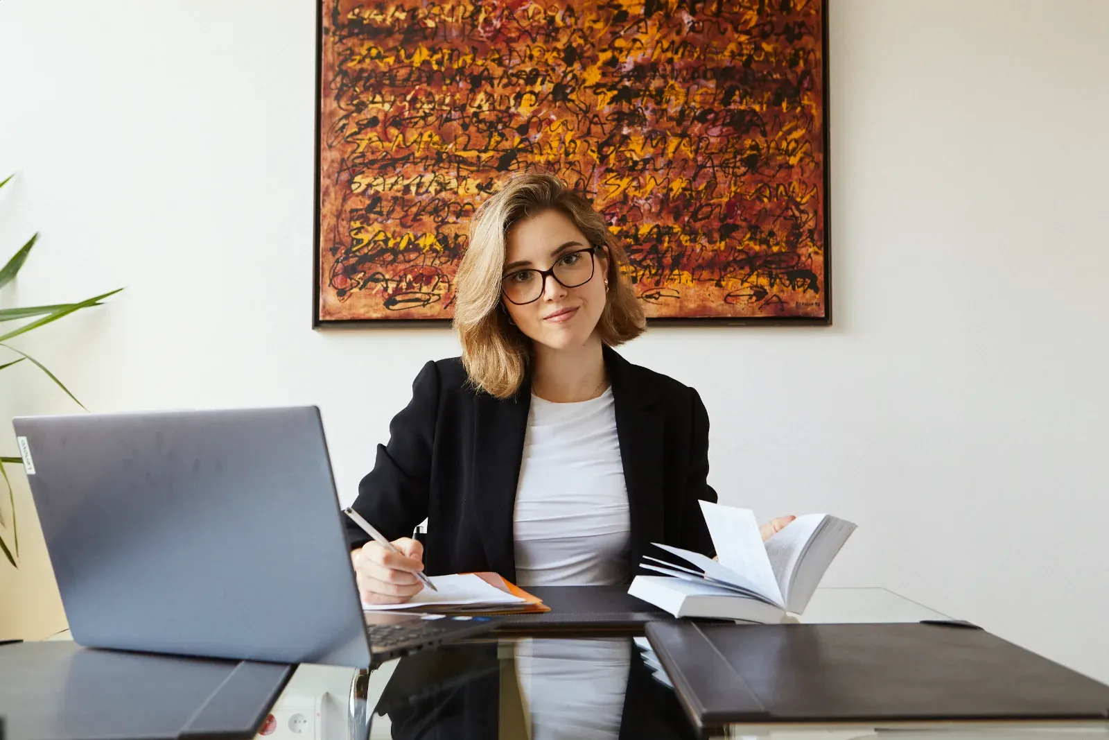Miriam Acerete at her desk, reviewing documents